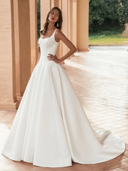Blue by Enzoani Ulandra luxury satin ballgown wedding dress featuring a scoop neckline, structured bodice and dramatic cathedral train.