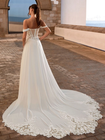 Love Felinna wedding dress by Enzoani featuring an illusion lace corset bodice, detachable off-the-shoulder straps, and a flowing chiffon A-line skirt for romantic elegance.